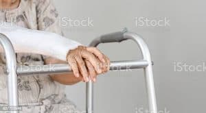 Elderly patient waiting on her walker